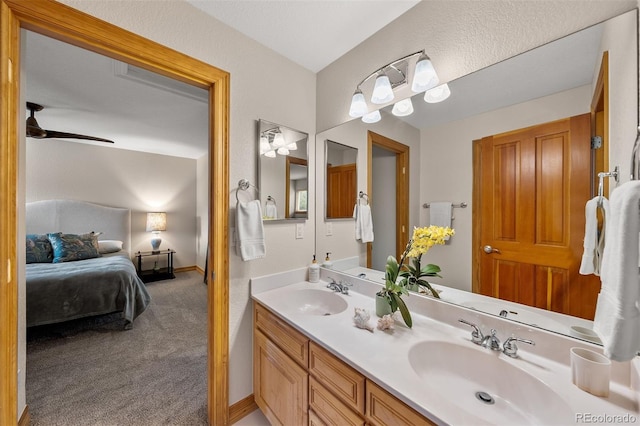 1999 Champions Cir, Castle Rock, CO 80104 - bathroom featuring connected bathroom, double vanity, and ceiling fan
