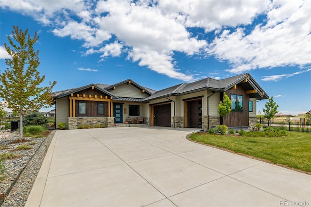 craftsman-style house with a garage and a front yard