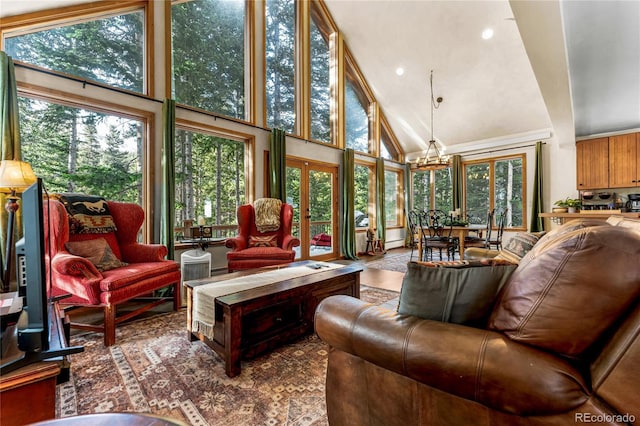 609 Brook Dr, Idaho Springs, CO 80452 - sunroom with french doors, healthy amount of natural light, vaulted ceiling, and a chandelier