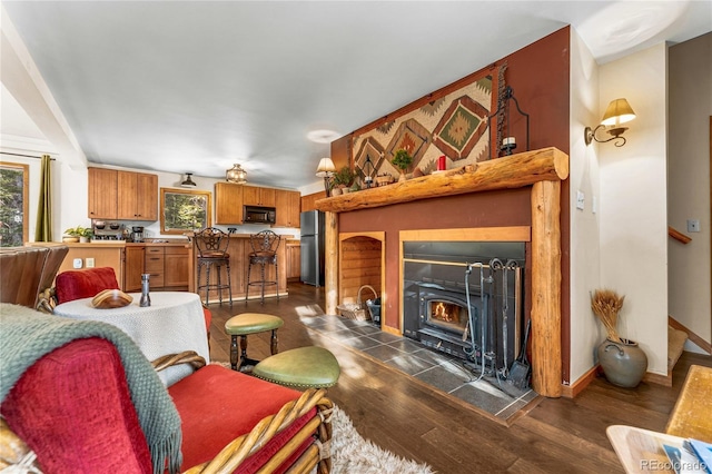 609 Brook Dr, Idaho Springs, CO 80452 - living area with dark wood-style floors and baseboards