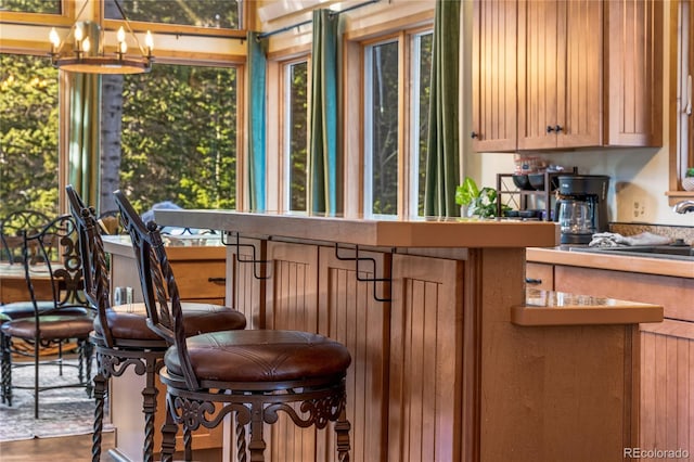 609 Brook Dr, Idaho Springs, CO 80452 - bar area featuring a chandelier and a sink