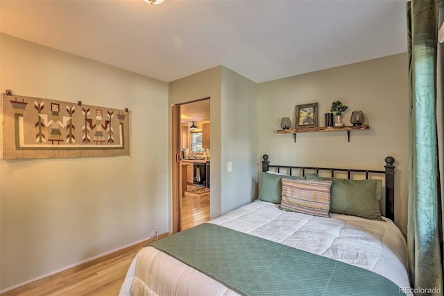 609 Brook Dr, Idaho Springs, CO 80452 - bedroom featuring wood finished floors and baseboards