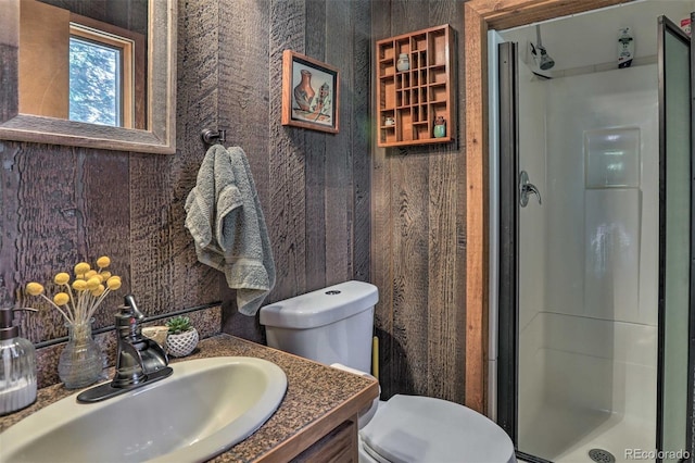 609 Brook Dr, Idaho Springs, CO 80452 - full bath with a stall shower, toilet, and vanity