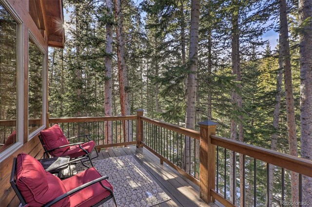 609 Brook Dr, Idaho Springs, CO 80452 - deck featuring a forest view