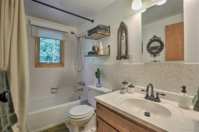 609 Brook Dr, Idaho Springs, CO 80452 - bathroom featuring tile walls, shower / tub combo, toilet, and vanity