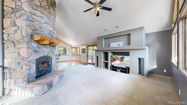 living area with ceiling fan, high vaulted ceiling, a fireplace, and baseboards