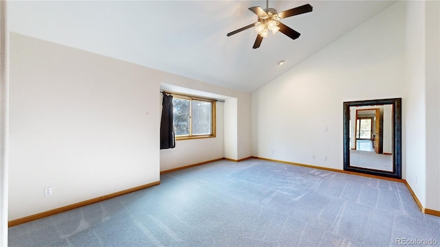 spare room with high vaulted ceiling, plenty of natural light, baseboards, and carpet flooring