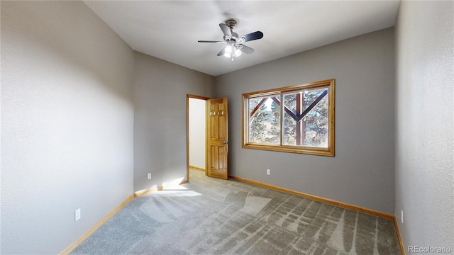 unfurnished bedroom featuring ceiling fan, carpet, and baseboards