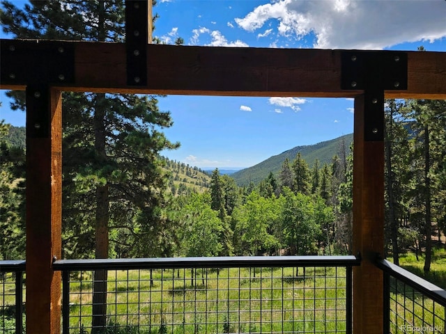 view of mountain feature with a view of trees