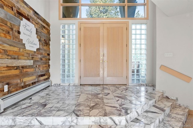 23655 Currant Dr, Golden, CO 80401 - entryway with baseboard heating, healthy amount of natural light, and marble finish floors