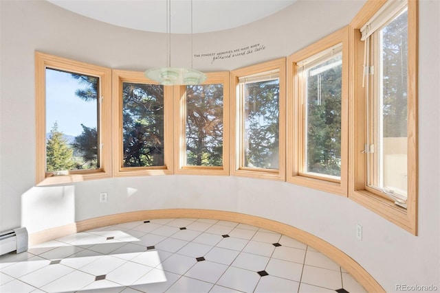 23655 Currant Dr, Golden, CO 80401 - unfurnished dining area featuring plenty of natural light and baseboard heating