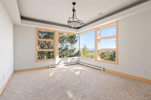 23655 Currant Dr, Golden, CO 80401 - carpeted spare room featuring a baseboard heating unit, plenty of natural light, and baseboards