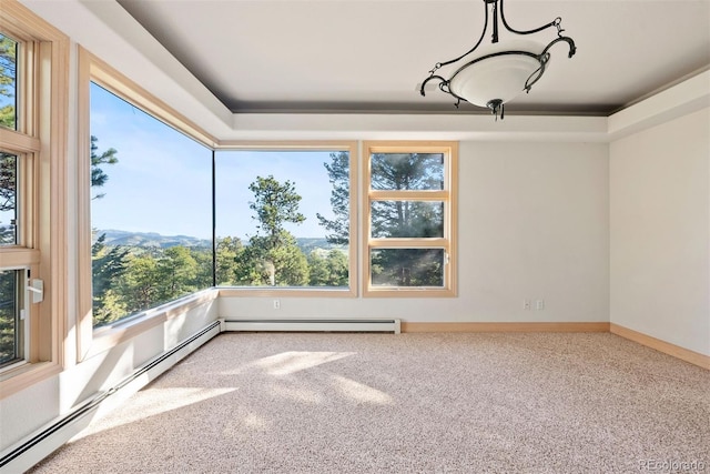 23655 Currant Dr, Golden, CO 80401 - carpeted spare room featuring plenty of natural light and a baseboard radiator