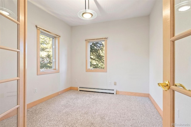 23655 Currant Dr, Golden, CO 80401 - carpeted spare room with a baseboard heating unit, healthy amount of natural light, and baseboards