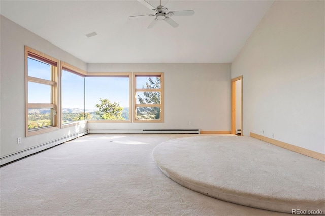 23655 Currant Dr, Golden, CO 80401 - carpeted spare room with lofted ceiling, a ceiling fan, a baseboard heating unit, baseboard heating, and baseboards