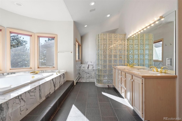 23655 Currant Dr, Golden, CO 80401 - full bathroom with plenty of natural light, a garden tub, double vanity, lofted ceiling, and tile patterned floors