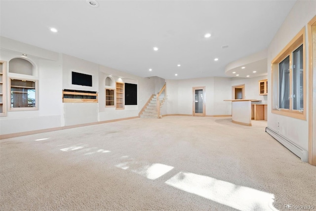 23655 Currant Dr, Golden, CO 80401 - unfurnished living room with baseboard heating, built in shelves, light carpet, recessed lighting, and baseboards
