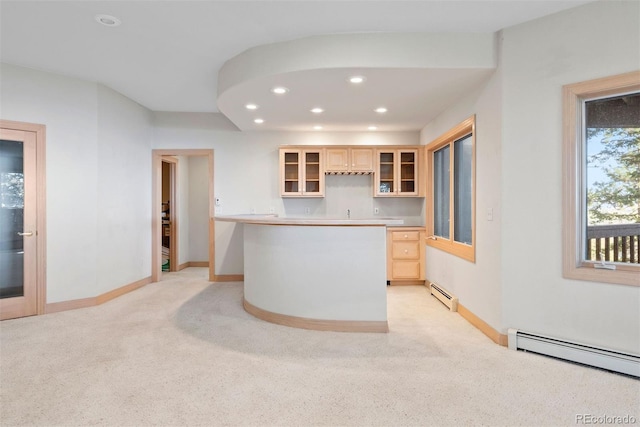 23655 Currant Dr, Golden, CO 80401 - kitchen with a baseboard radiator, light carpet, recessed lighting, baseboards, and glass insert cabinets
