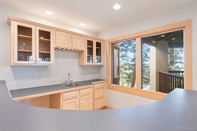 23655 Currant Dr, Golden, CO 80401 - kitchen with a sink, light brown cabinets, glass insert cabinets, and recessed lighting