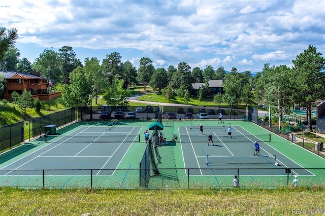 23655 Currant Dr, Golden, CO 80401 - view of tennis court with community basketball court and view of wooded area