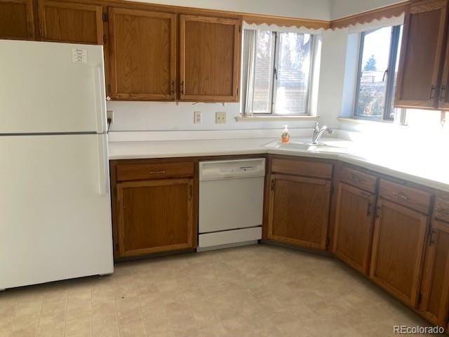 kitchen with sink and white appliances