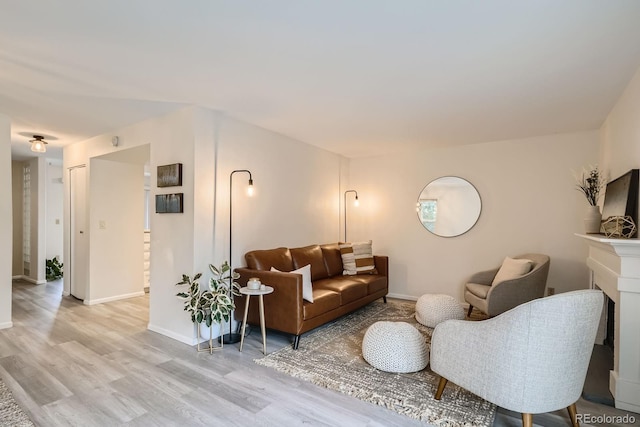 108 S Holman Way, Golden, CO 80401 - living area with light wood-style floors and baseboards