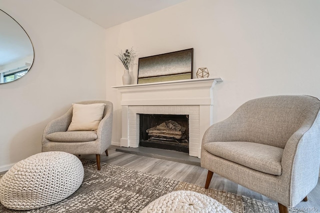 108 S Holman Way, Golden, CO 80401 - living area with wood finished floors and a brick fireplace