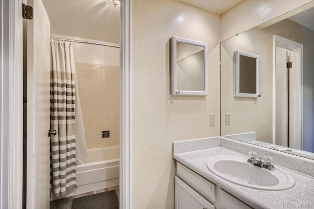 108 S Holman Way, Golden, CO 80401 - bathroom with a textured wall, vanity, and shower / tub combo