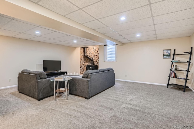 108 S Holman Way, Golden, CO 80401 - living area with carpet flooring, a wood stove, a paneled ceiling, and recessed lighting