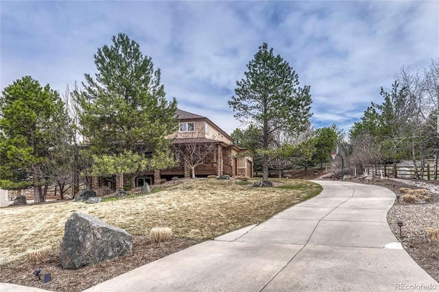view of yard with concrete driveway