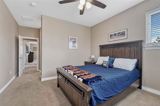 bedroom featuring baseboards, visible vents, a ceiling fan, and light carpet