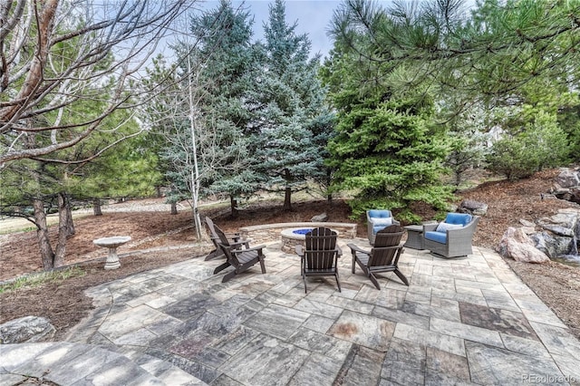 view of patio / terrace with a fire pit