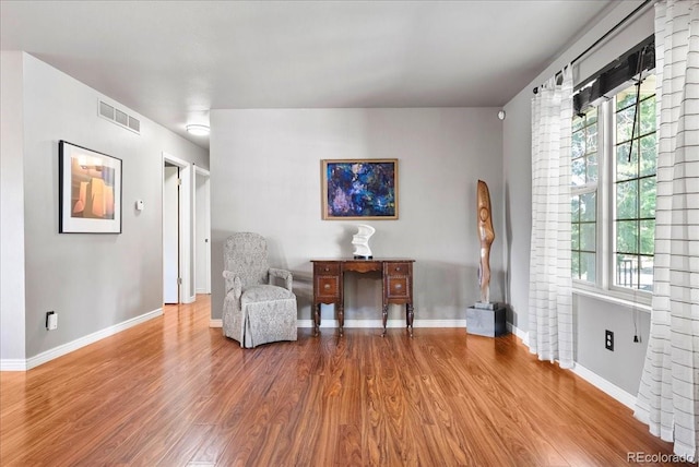 4351 S Evanston Ct, Aurora, CO 80015 - living area featuring wood finished floors and healthy amount of natural light