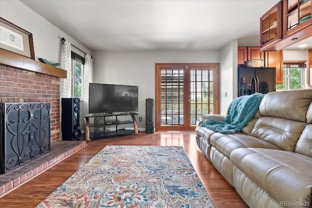 4351 S Evanston Ct, Aurora, CO 80015 - living room with plenty of natural light, a fireplace, and wood finished floors