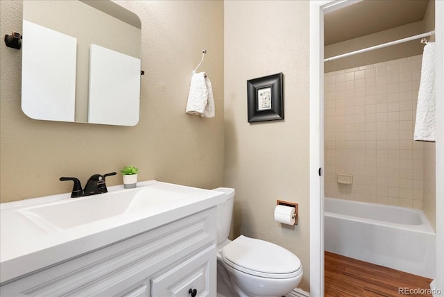 4351 S Evanston Ct, Aurora, CO 80015 - bathroom with vanity, bathtub / shower combination, and wood finished floors