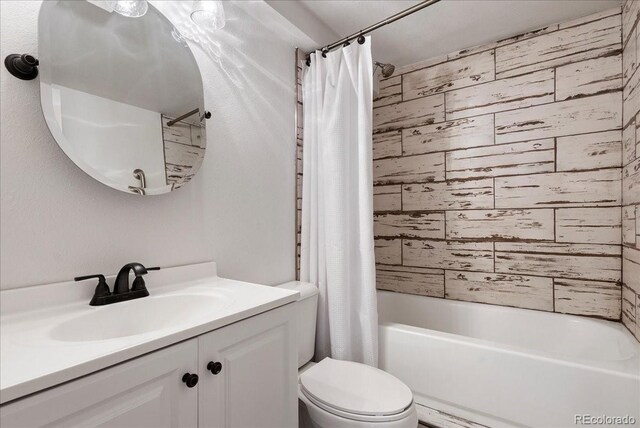 4351 S Evanston Ct, Aurora, CO 80015 - bathroom featuring vanity and shower / bathtub combination with curtain