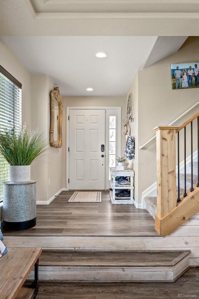 3871 Starry Night Loop, Castle Rock, CO 80109 - foyer featuring healthy amount of natural light, wood finished floors, stairs, and recessed lighting
