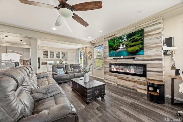 3871 Starry Night Loop, Castle Rock, CO 80109 - living area with a glass covered fireplace, ceiling fan, wood finished floors, and recessed lighting