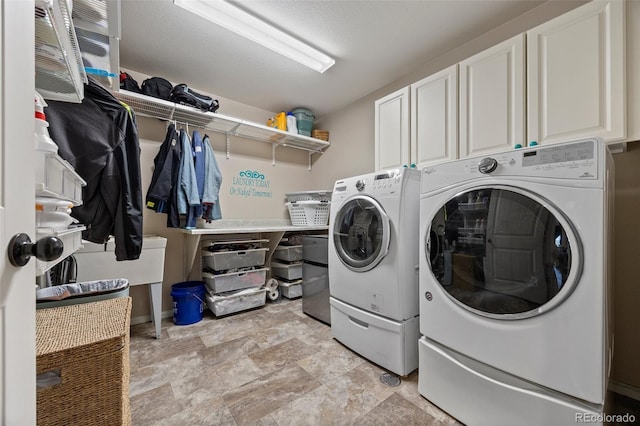 3871 Starry Night Loop, Castle Rock, CO 80109 - laundry room with cabinet space, separate washer and dryer, and stone finish floors