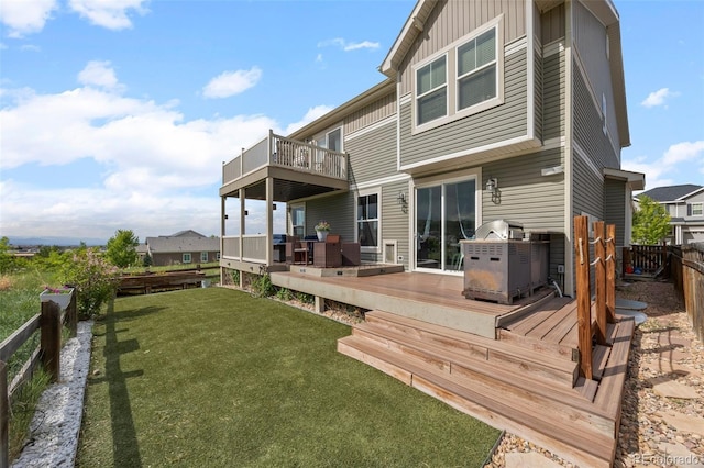 3871 Starry Night Loop, Castle Rock, CO 80109 - back of property with a fenced backyard, a deck, and board and batten siding