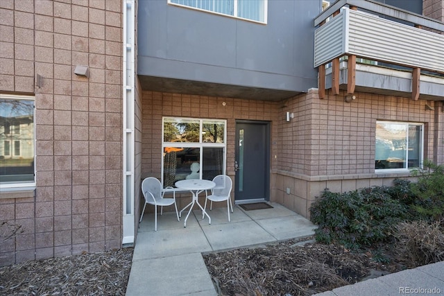 property entrance featuring a patio area