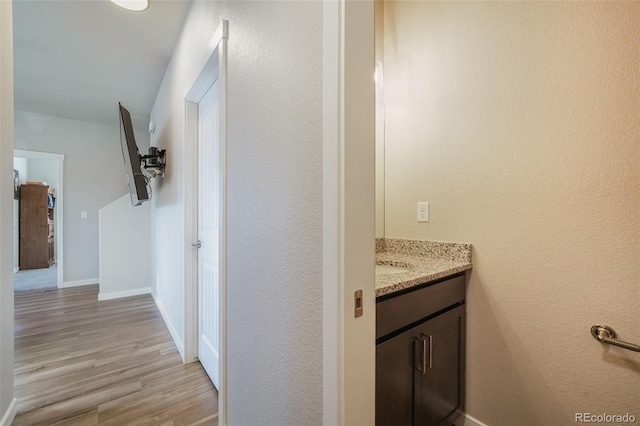 bathroom with vanity and hardwood / wood-style floors