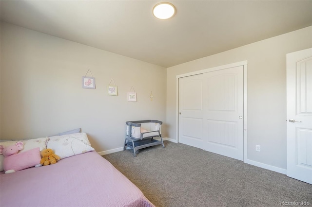 bedroom with carpet floors and a closet