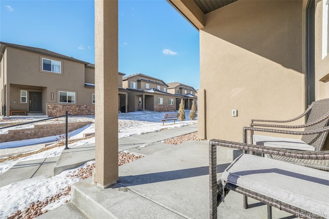 view of snow covered patio