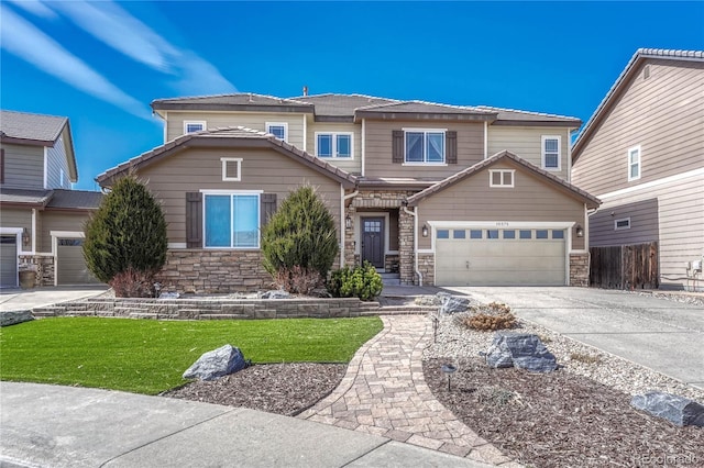 view of front of property featuring stone siding, driveway, and a front lawn