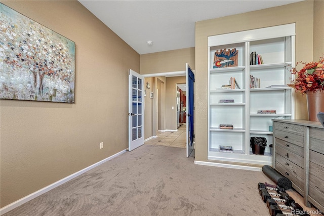 unfurnished bedroom featuring baseboards and carpet floors