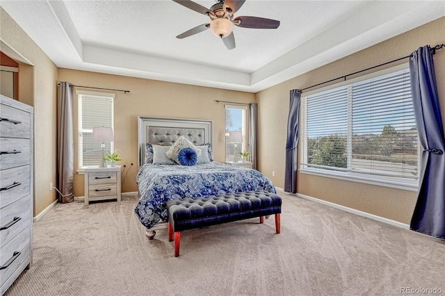 bedroom with carpet, baseboards, and ceiling fan