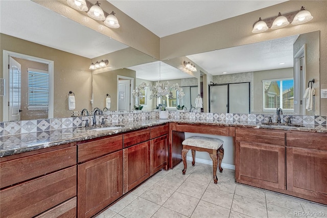 full bath with tile patterned floors, backsplash, a stall shower, and vanity