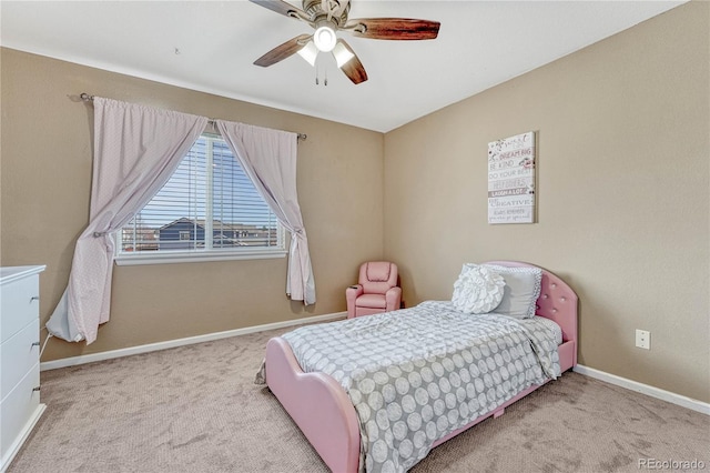 bedroom featuring ceiling fan, baseboards, and carpet floors