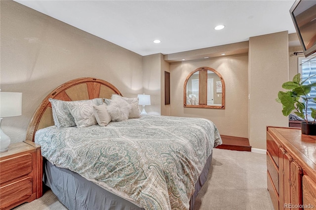 bedroom featuring recessed lighting, baseboards, and light carpet